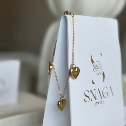 IZIA - Bracelet création en acier Inoxydable doré et pendentifs cœur