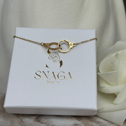 AURELIE - Bracelet en acier Inoxydable doré détails menottes