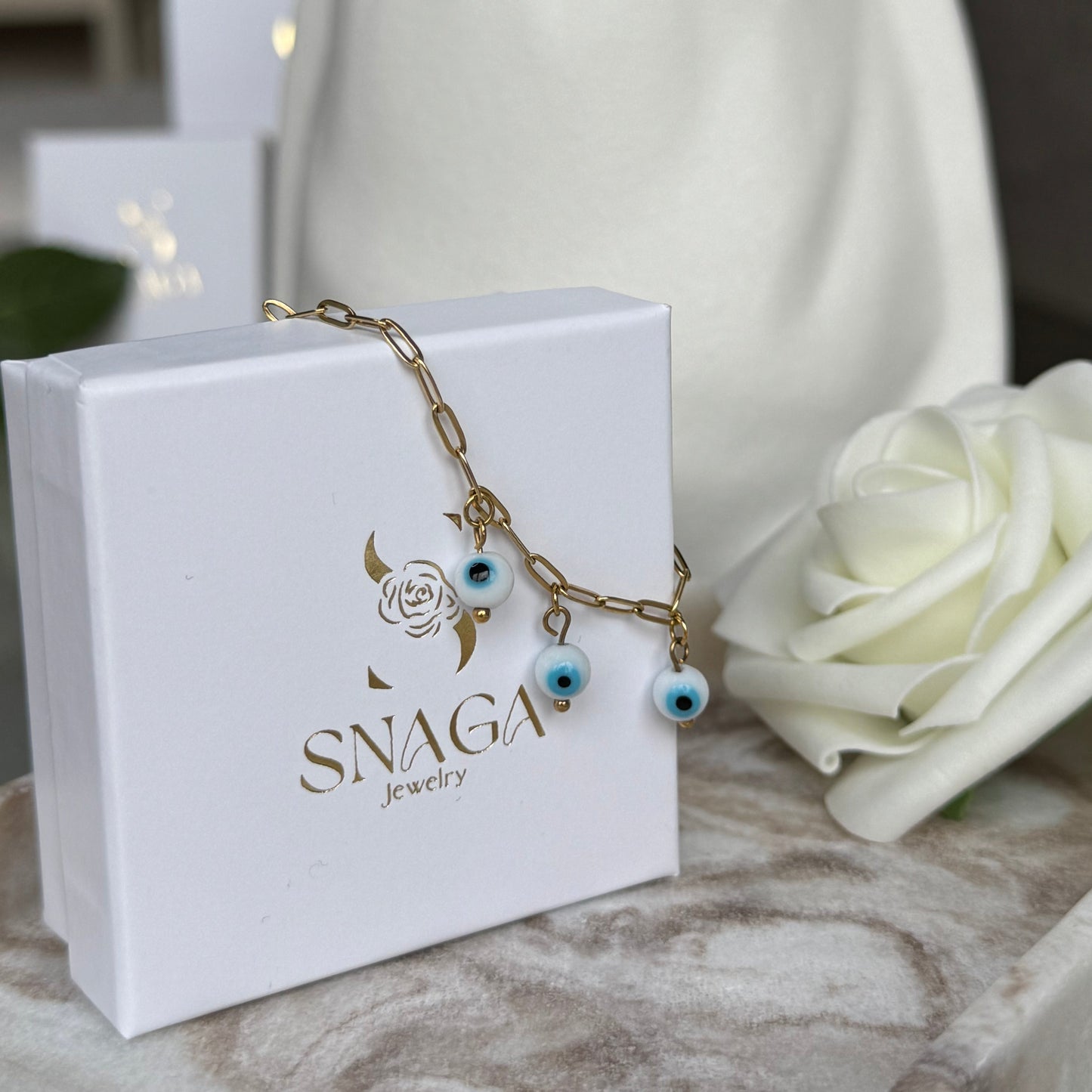 ELENA - Bracelet création en acier Inoxydable doré et perles œil de protection