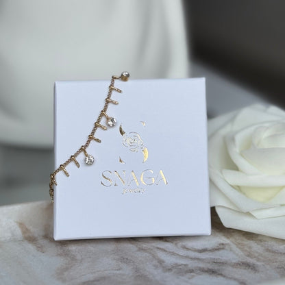 LOLA - Bracelet en acier Inoxydable doré avec pampilles et strass