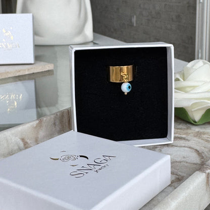 ELENA - Bague création en acier Inoxydable doré et œil de protection bleu clair